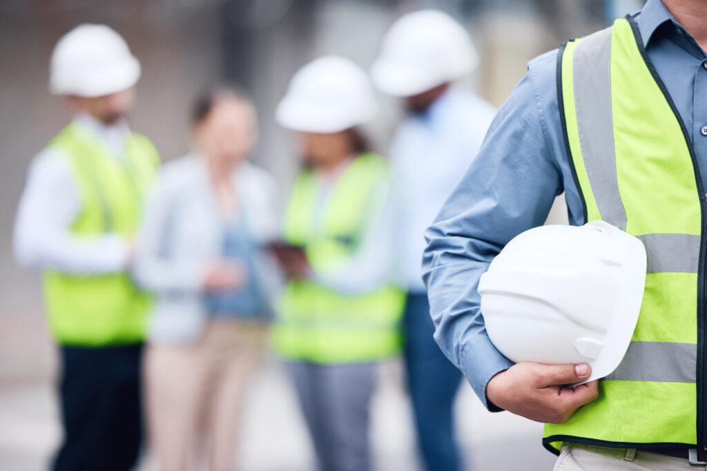 Men holding hard hats.