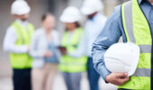 Men holding hard hats.