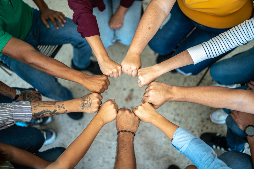 Close-up of a team doing fist bump