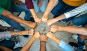 Close-up of a team doing fist bump
